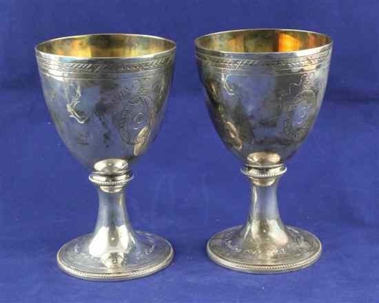 Appraisal: A pair of modern silver goblets with engraved inscriptions and