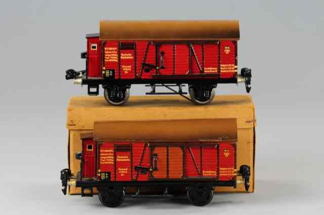 Appraisal: TWO MARKLIN BOX CARS O gauge lithographed tin bodies opening