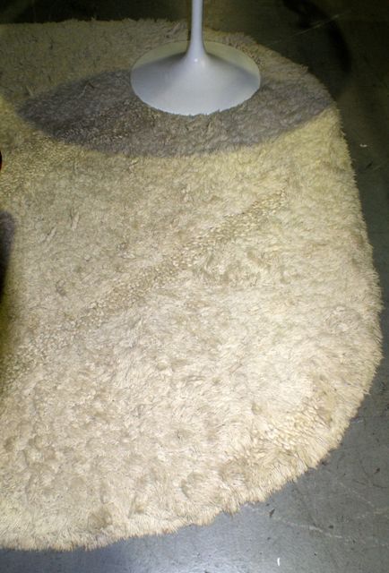 Appraisal: A large contemporary natural wool rug with alternating woven textures