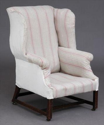 Appraisal: GEORGE III MAHOGANY WING ARMCHAIR With slightly roll-over top rail