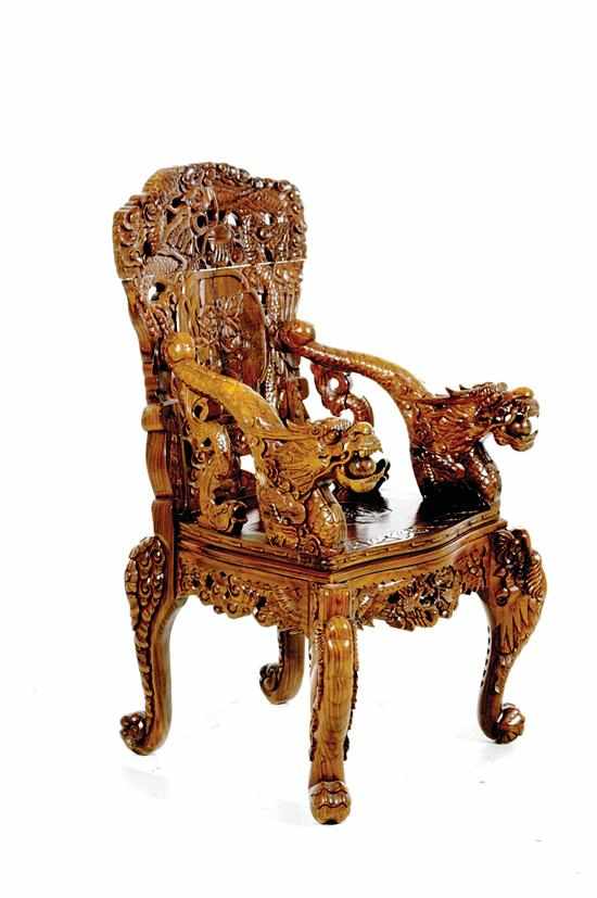 Appraisal: Oriental carved hardwood armchair late th century shaped and pierced