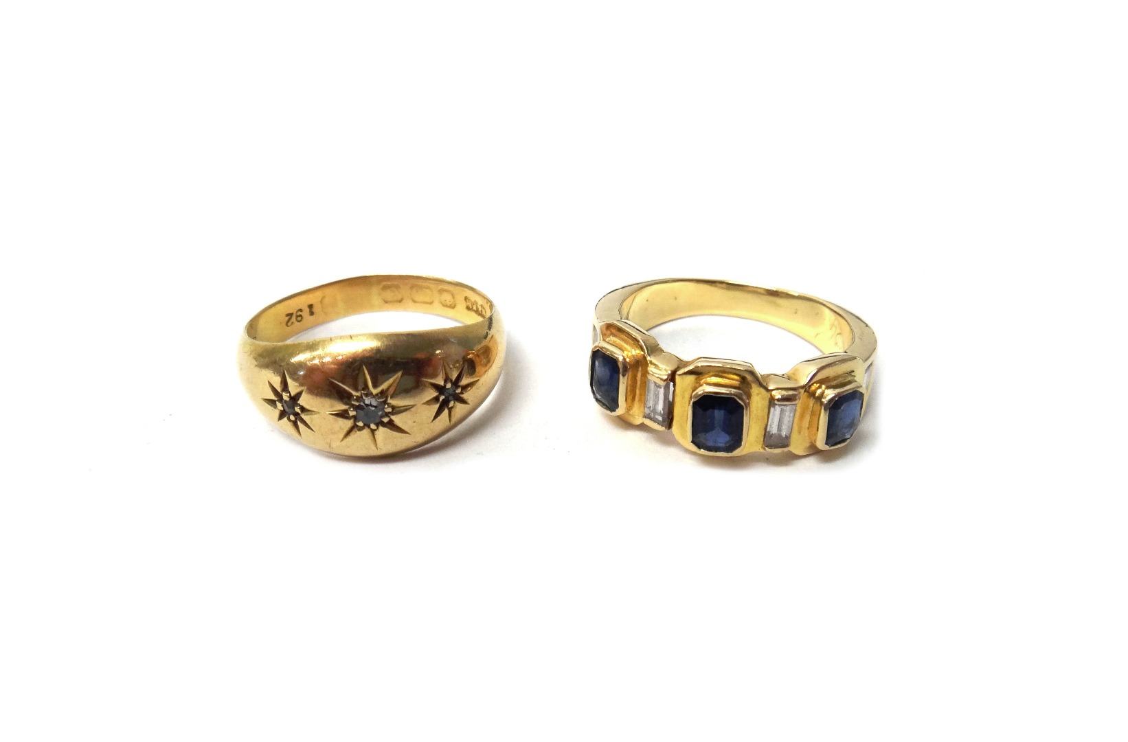 Appraisal: A gold ring mounted with three cut cornered rectangular cut