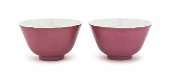 Appraisal: A Pair of Red Glazed Bowls of footed circular form