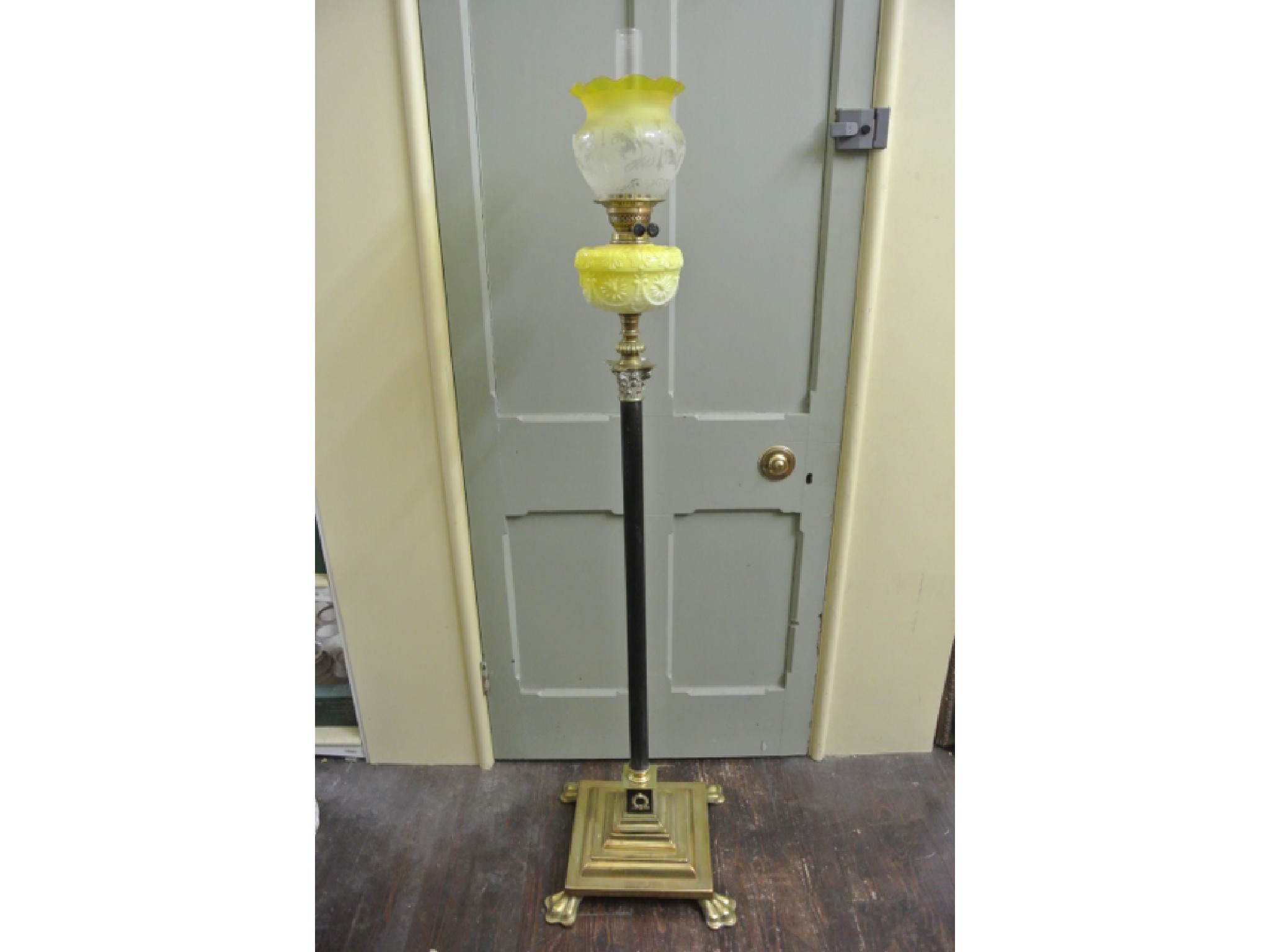 Appraisal: A Victorian brass oil lamp standard in the form of