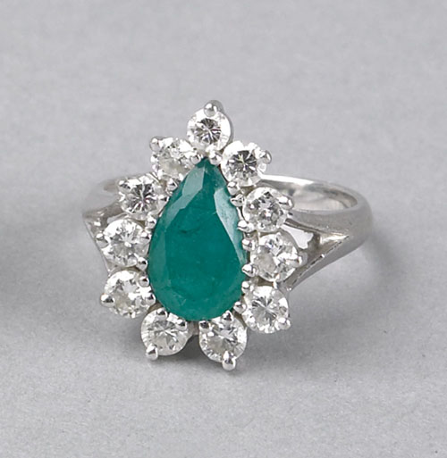 Appraisal: Emerald and diamond K white gold ring with central pear