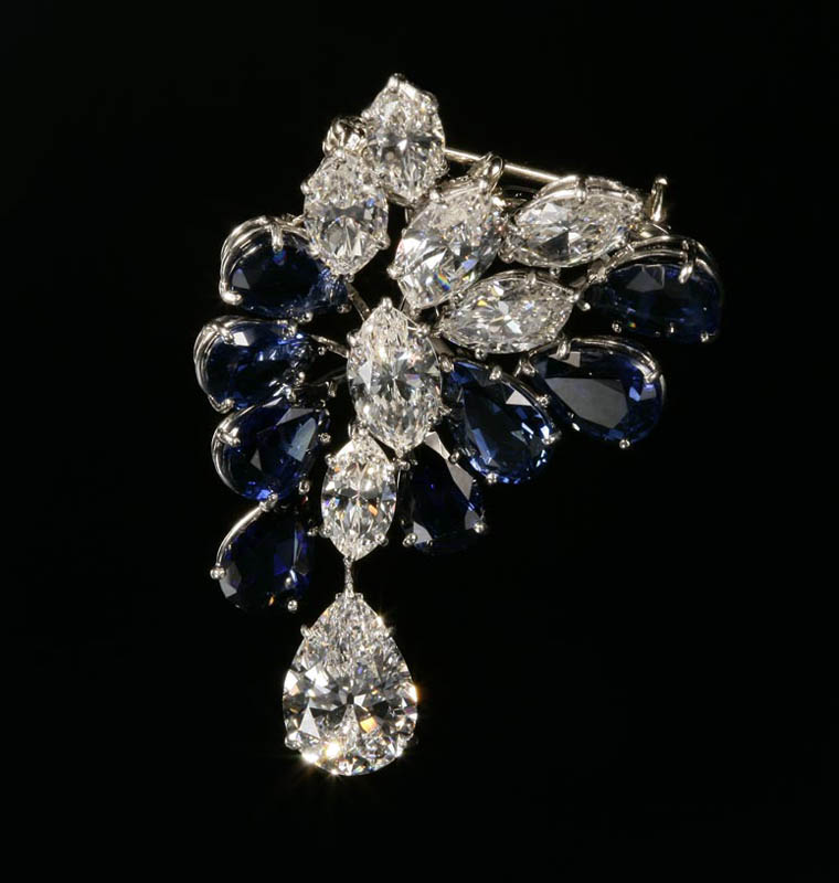 Appraisal: A diamond and sapphire pendant brooch A diamond and sapphire