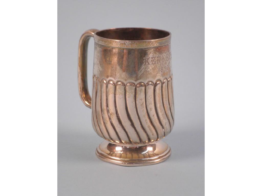 Appraisal: A Victorian part fluted christening mug with tapering base engraved