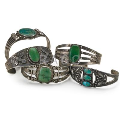 Appraisal: NAVAJO BRACELETS Five all with silver drops stamp work and