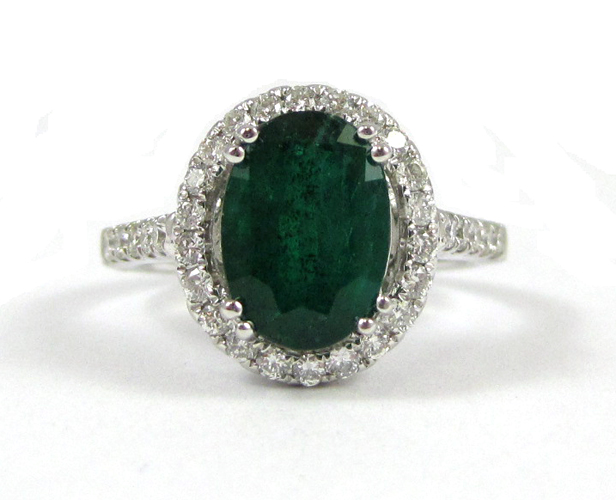 Appraisal: EMERALD DIAMOND AND FOURTEEN KARAT GOLD RING The white gold