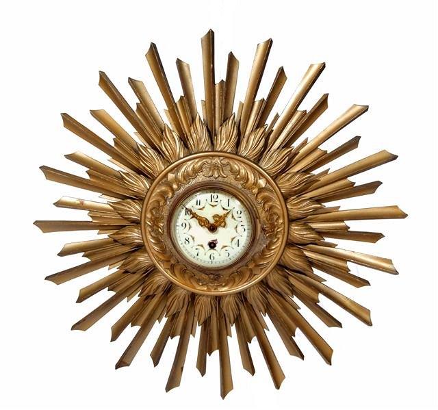 Appraisal: A FRENCH GILT PAINTED STAR CLOCK with circular enamel dial