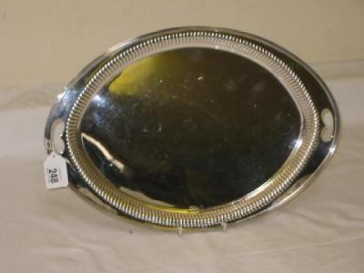 Appraisal: A VICTORIAN TEA TRAY of oval form with embossed fluted