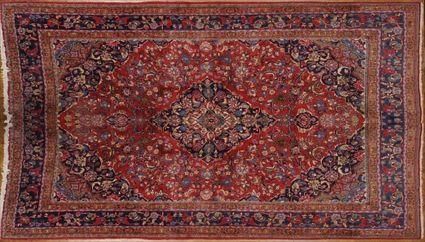 Appraisal: PERSIAN ROSE-GROUND MEDALLION CARPET The cobalt medallion and spandrels on