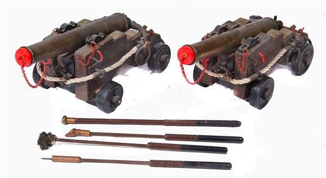 Appraisal: A PAIR OF BLACK POWDER SIGNAL CANNONS with brass barrels