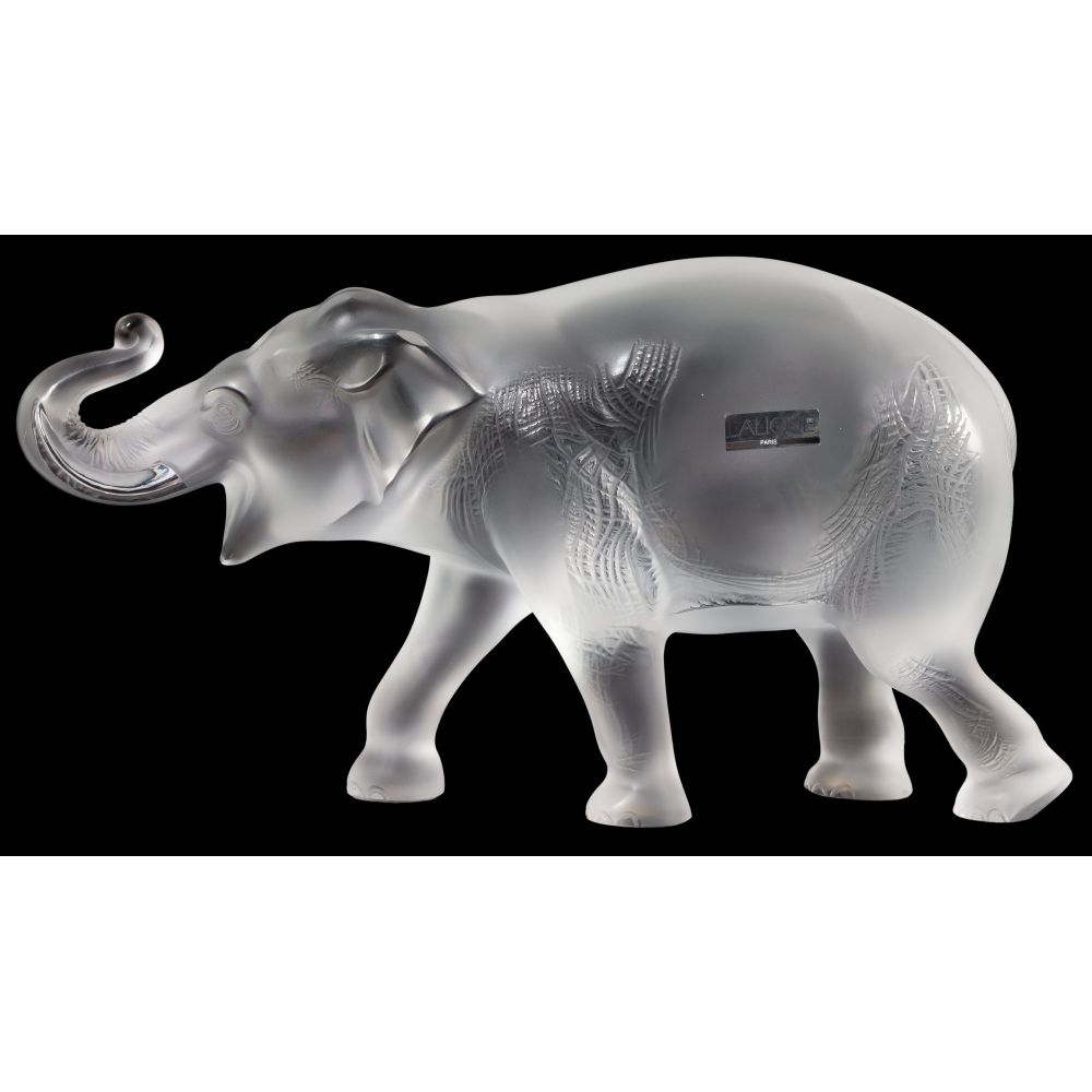 Appraisal: LALIQUE CRYSTAL SUMATRAN ELEPHANTDepicted walking with trunk up frosted and