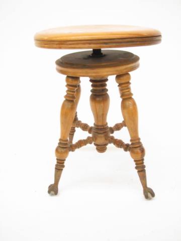 Appraisal: An antique organ stool with glass ball and talon feet