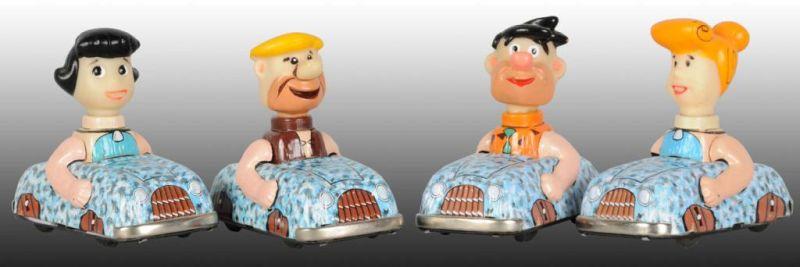 Appraisal: Set of Marx Tin Friction Flintstone Toy Cars Description All