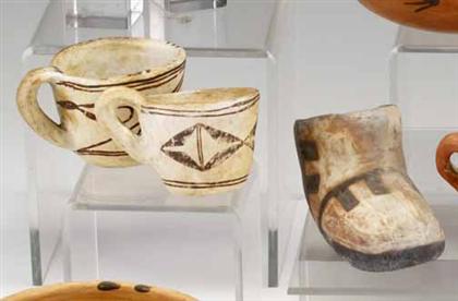 Appraisal: Three Hopi pottery items A small polychrome shoe-shaped jar and