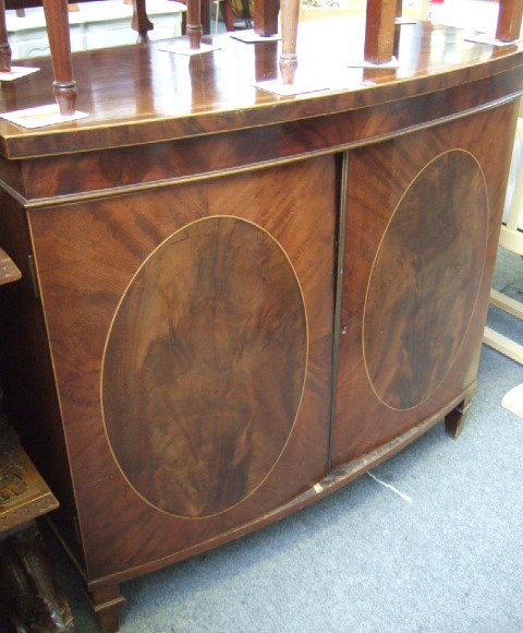 Appraisal: A mahogany bowfront cabinet of George III design late th