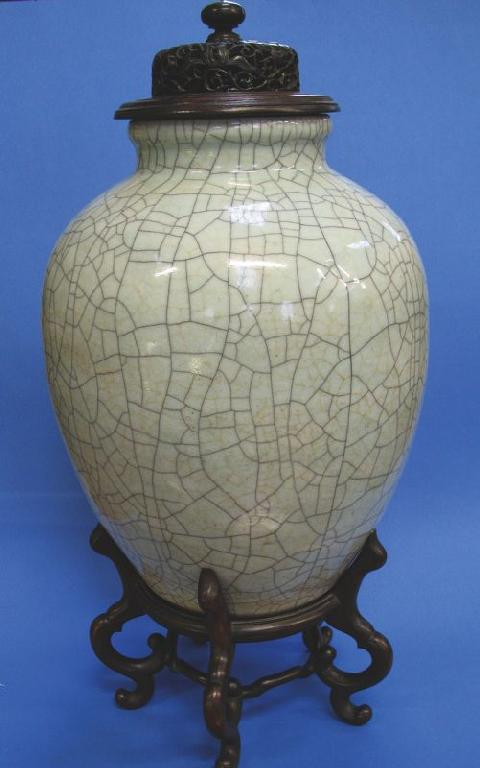 Appraisal: A CHINESE OVOID CRACKLEWARE VASE covered in a cream glaze