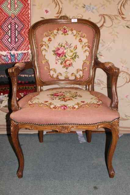 Appraisal: A FRENCH BEECHWOOD FRAMED SALON ARMCHAIR with shaped arms cabriole