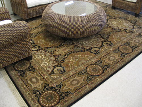 Appraisal: HAND KNOTTED ORIENTAL ROOM-SIZE CARPET repeating floral medallion design covering