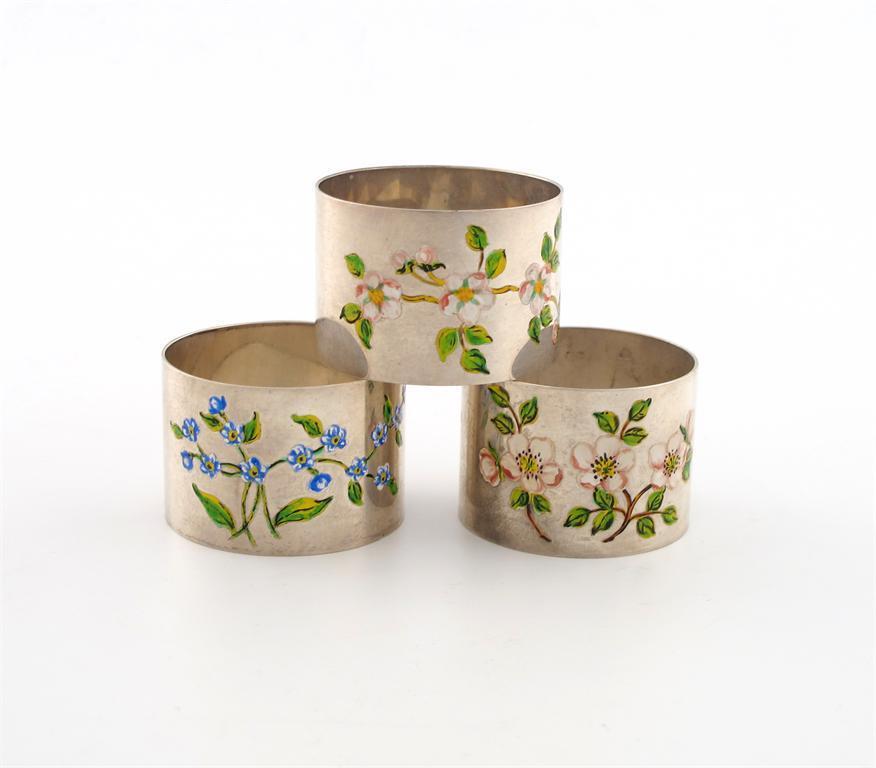 Appraisal: A set of three modern silver and enamel napkin rings