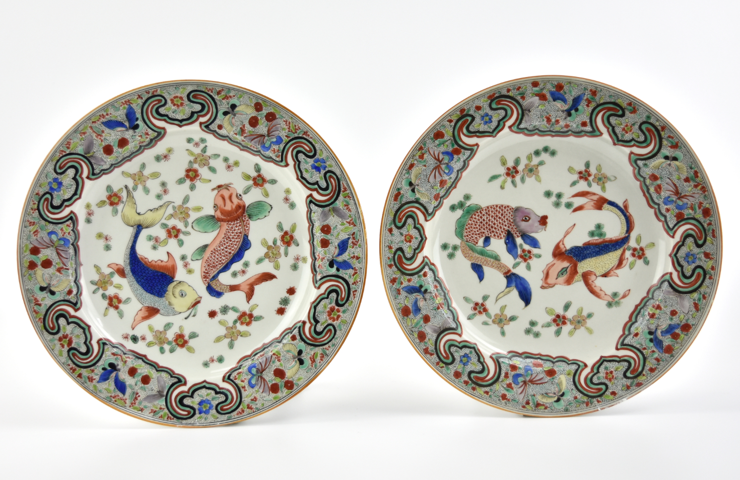 Appraisal: Freanch th C famille verte glazed plates decorated with fishes