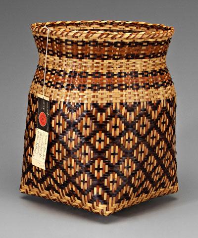 Appraisal: Eva Wolfe river cane basket square-to-round design butternut and bloodroot