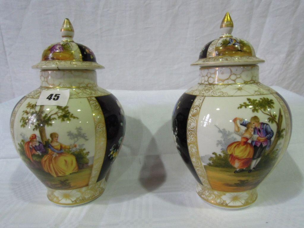 Appraisal: A pair of covered vases in the Dresden manner decorated