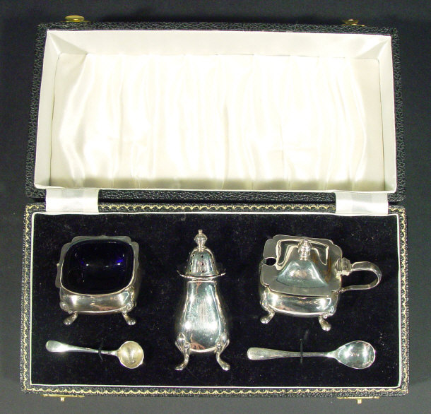 Appraisal: Silver three piece cruet set with blue cut glass liners