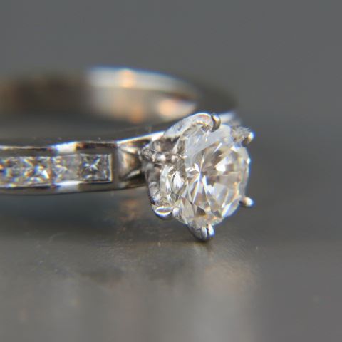 Appraisal: Diamond Platinum Ring carat round brilliant diamond with four square