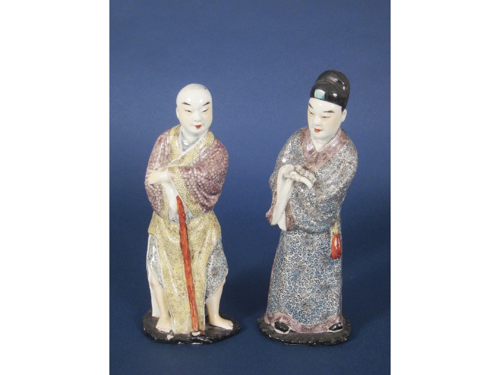 Appraisal: Two Chinese polychrome standing Figures of lady and gent with