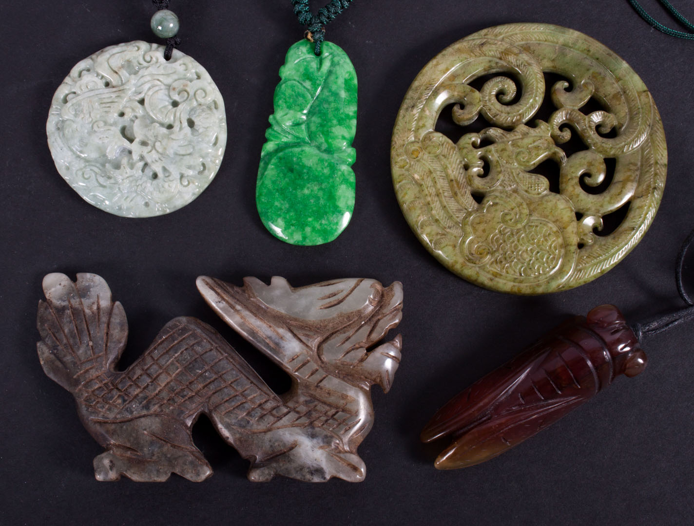 Appraisal: assorted Chinese carved jade pendants amulets including dragons cicada and