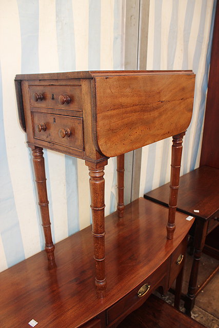 Appraisal: A VICTORIAN MAHOGANY DROP FLAP WORK TABLE two drawers to