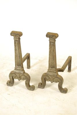 Appraisal: A pair of cast iron andirons in Elizabethan style the