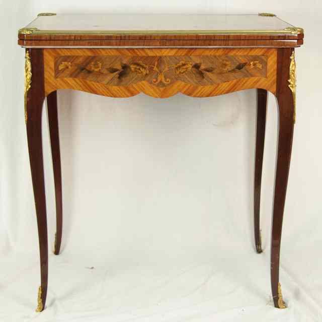 Appraisal: A French kingwood and marquetry table gilt metal mounted fitted