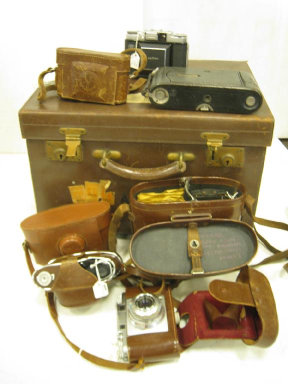 Appraisal: Leather Carry Case containing various Compact Cameras including Purma Frankette