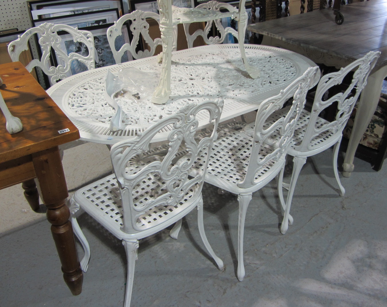 Appraisal: A white painted aluminium table and six matching chairs