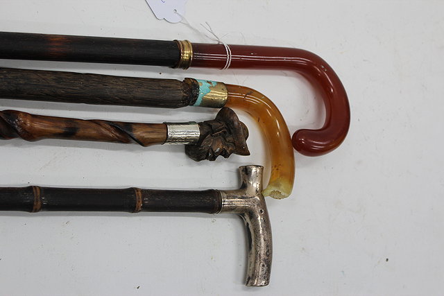 Appraisal: AN EARLY TH CENTURY WALKING STICK with amber style crook