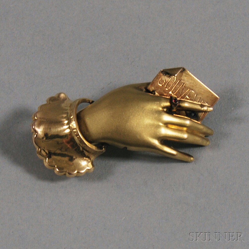 Appraisal: kt Gold Hand Brooch the woman's hand wearing a gem-set