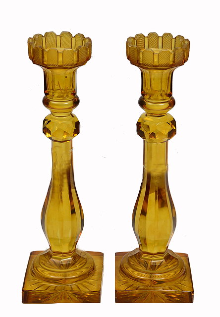 Appraisal: A PAIR OF TH CENTURY AMBER CUT GLASS CANDLE STICKS