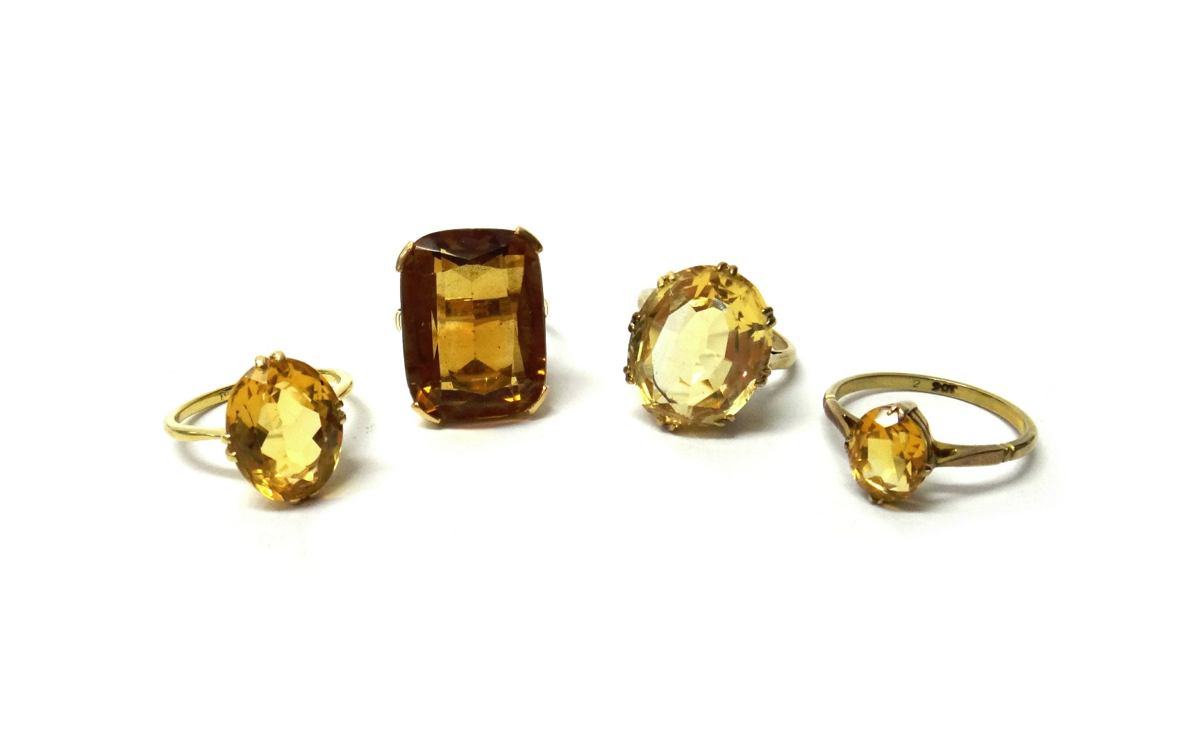 Appraisal: A gold ring claw set with an oval cut citrine