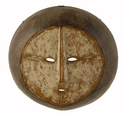 Appraisal: A Lega circular mask with pierced eyes and mouth with