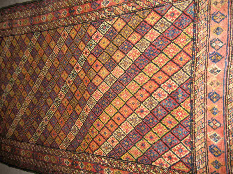 Appraisal: KURDISH JAF AREA RUG The central field with a pattern