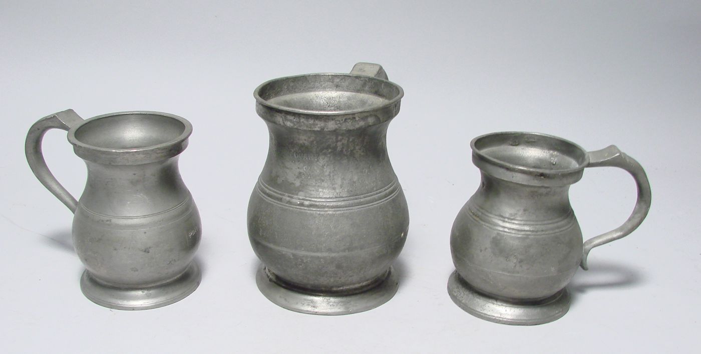 Appraisal: THREE ENGLISH PEWTER MEASURES th CenturyOne by Yates height one