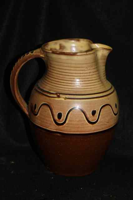 Appraisal: A STUDIO SLIPWARE POTTERY JUG possibly Winchcombe high