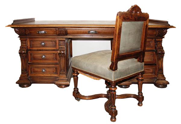 Appraisal: A Renaissance Revival carved mahogany writing desk together with a