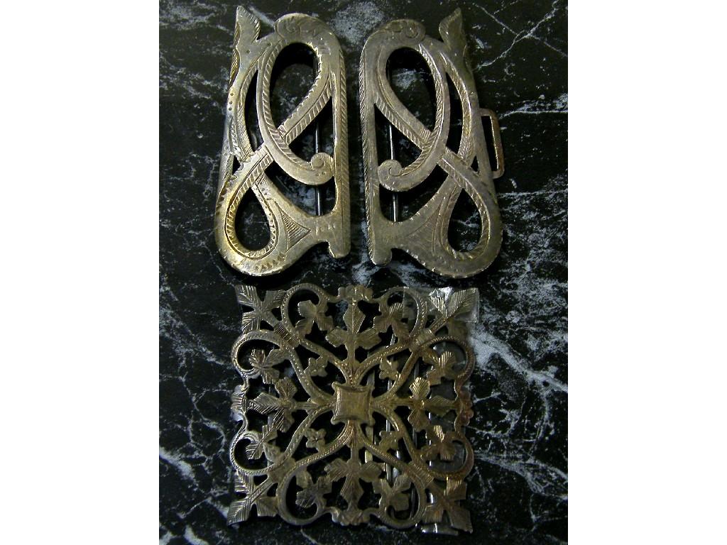 Appraisal: Three silver engraved belt buckles