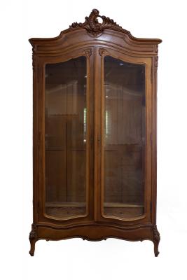 Appraisal: A French satinwood armoire the moulded arch-top with open shell