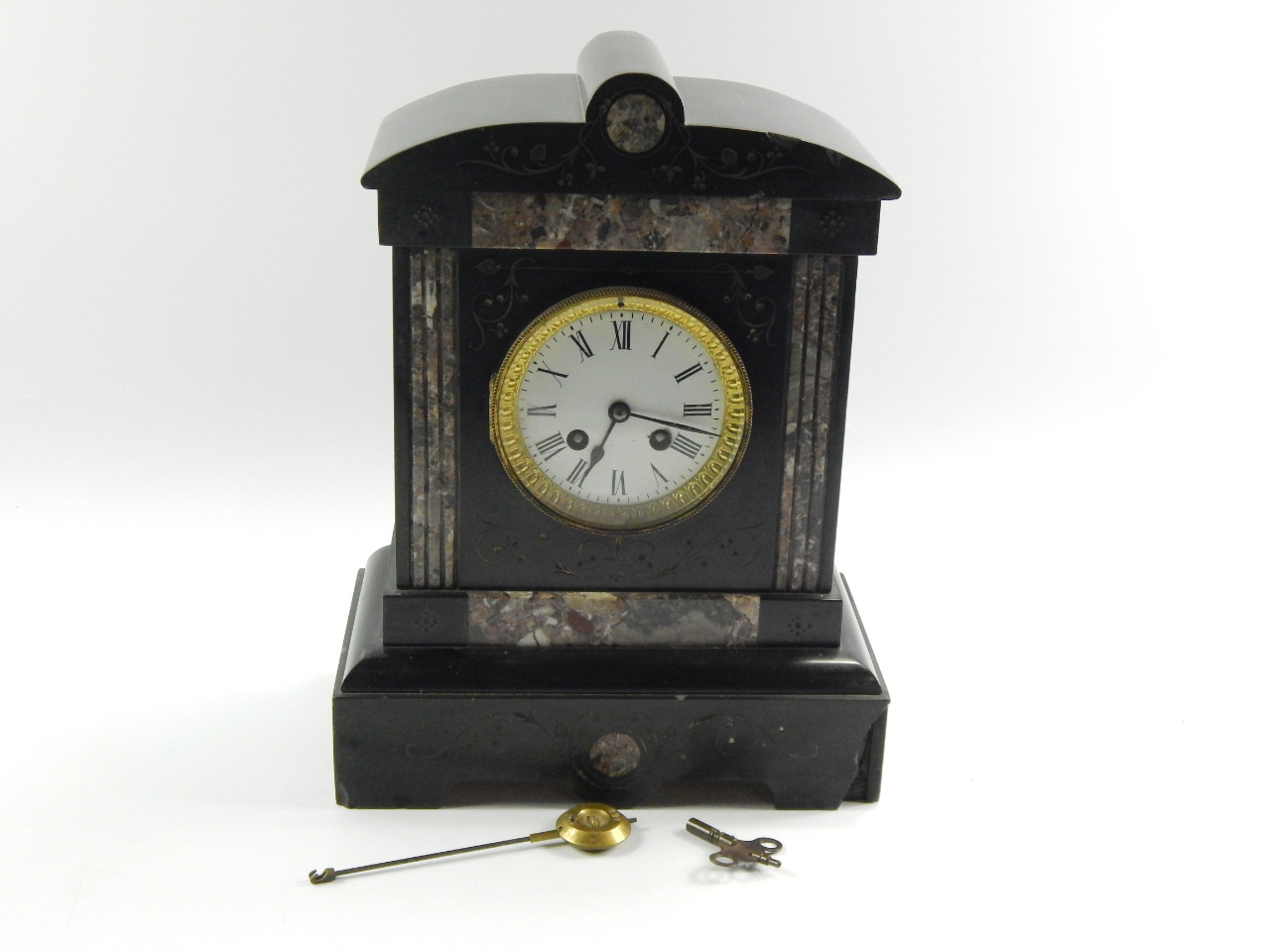 Appraisal: A Victorian marble and slate mantel clock of architectural form